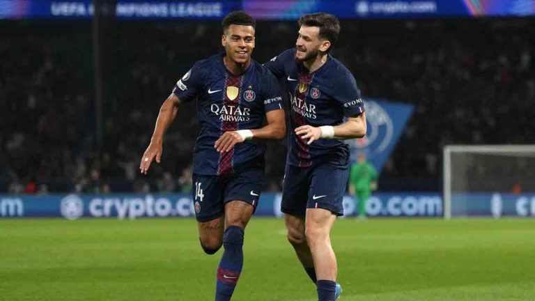 PSG's Desire Doue, left, celebrates with PSG's Khvicha Kvaratskhelia after scoring the opening goal during the Champions League quarterfinal first leg soccer match between Paris Saint-Germain and Liverpool in Paris, Wednesday, April 8, 2026. (Thibault Camus/AP)