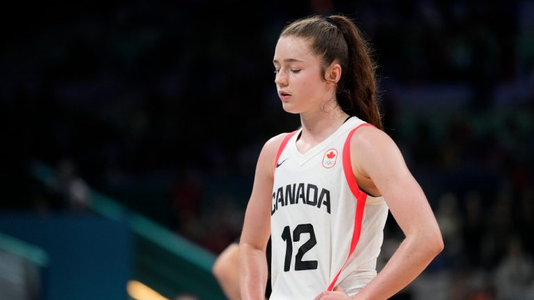 Syla Swords (12), of Canada, walks off the court after a loss to Nigeria in a women's basketball game at the 2024 Summer Olympics, Sunday, Aug. 4, 2024, in Villeneuve-d'Ascq, France. (Mark J. Terrill/AP) 